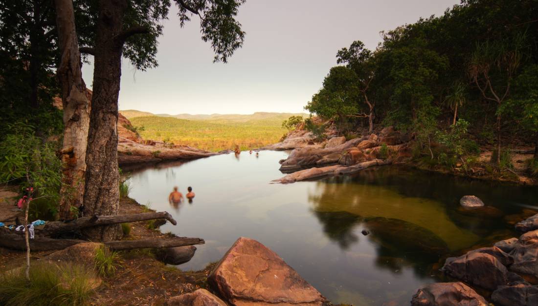 Relaxing in the waterhole above Gunlom Waterfall on the Kakadu Walking Adventure | <i>Rhys Clarke</i>