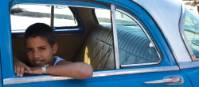 Young boy sitting in a car in Havana | <i>Vanessa Dean</i>