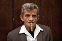 Cuban man enjoying a Cuban cigar | <i>Vanessa Dean</i>