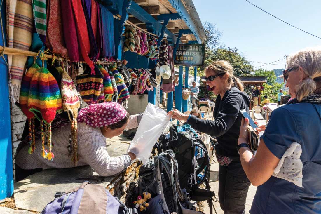 Interacting with a local shopkeeper along the trail |  Joe Kennedy