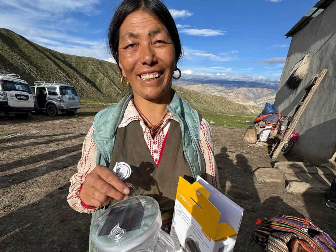 Margie Thomas delivering solar lamps, courtesy of Paddy Pallin, in Mustang