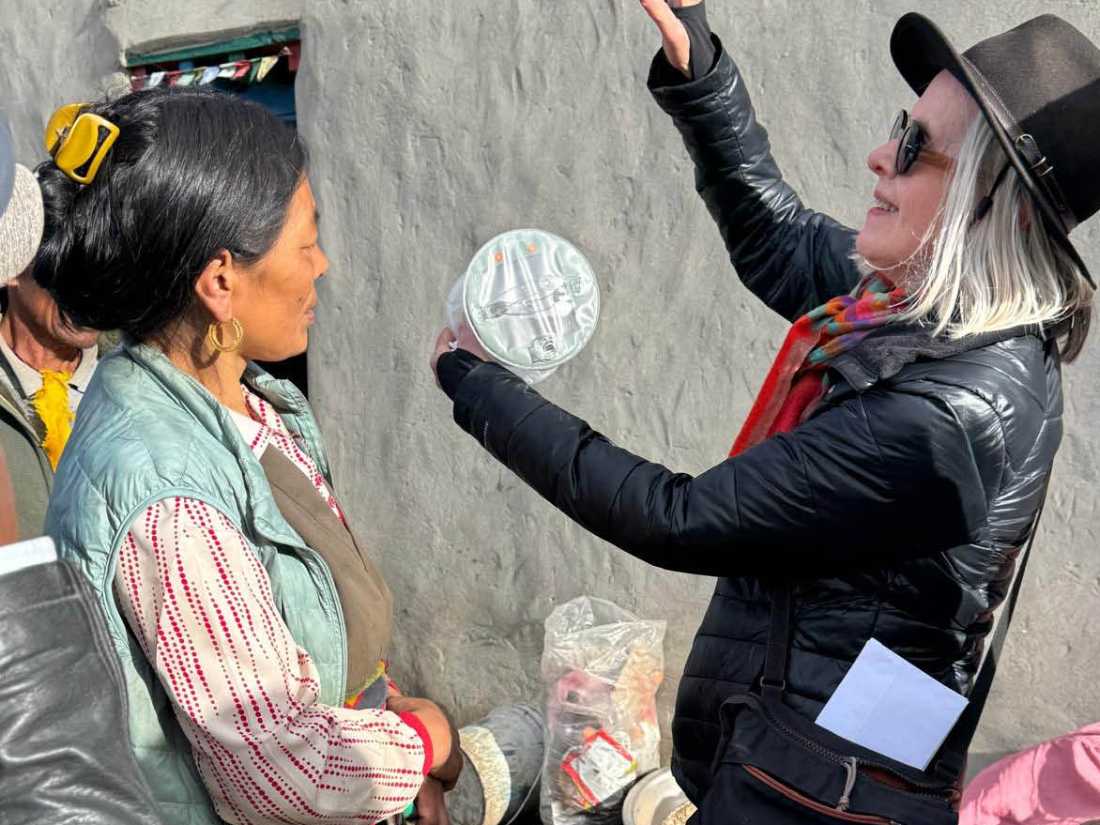 Margie Thomas delivering solar lamps, courtesy of Paddy Pallin, in Mustang