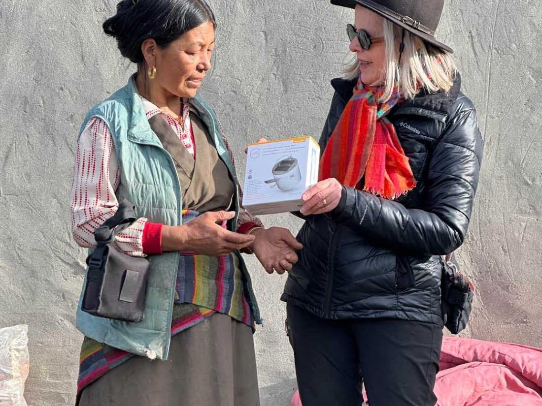 Margie Thomas delivering solar lamps, courtesy of Paddy Pallin, in Mustang