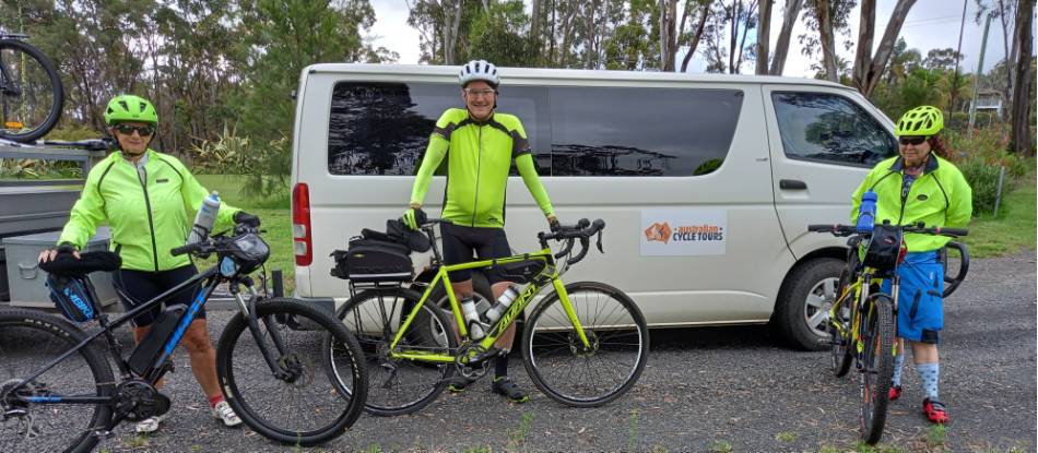 Cyclists posing with their bikes on a supported cycle tour. |  <i>Shawn Flannery</i>